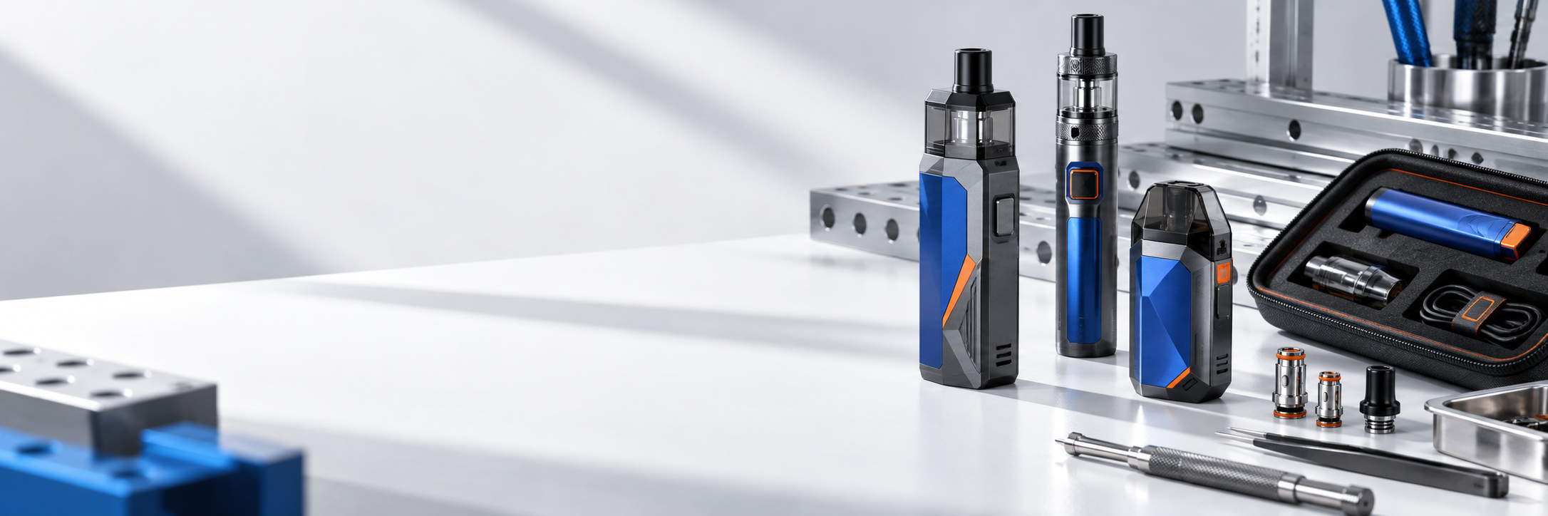 Adult vape devices, replacement pods and charging accessories arranged in a modern product studio.
